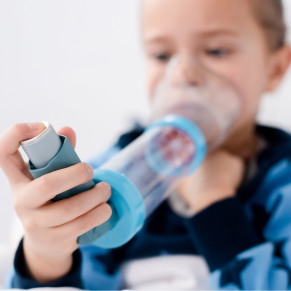 Selective Focus Of Asthmatic Child Using Inhaler With Spacer